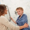 image:imageMoen Chrome Bathroom Safety 24Inch Designer Safety Shower Grab Bar with Curled Grip LR8724D3GCHBrushed Nickel